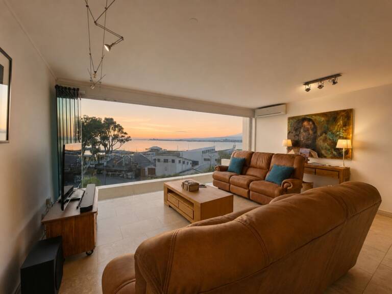 24 gordonia gordons bay 05 comfortable living room with ocean sunset view 1 768x576