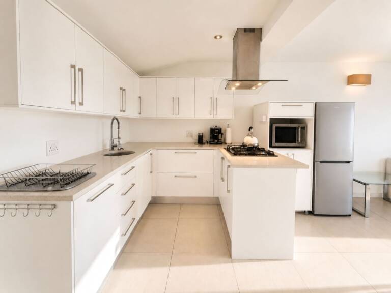 24 gordonia gordons bay 14 upper floor kitchen and braai with modern appliances 1 768x576