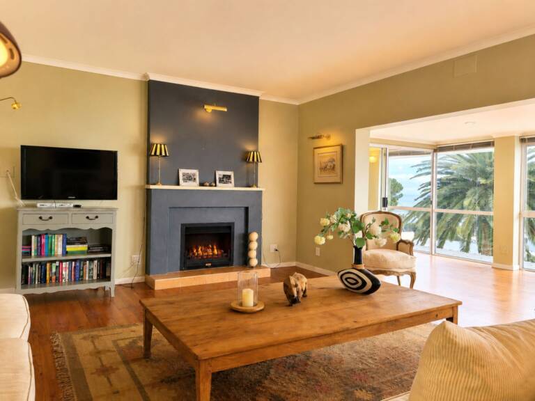 amazing view villa gordons bay 21 holiday house living room with fire place and tv 768x576