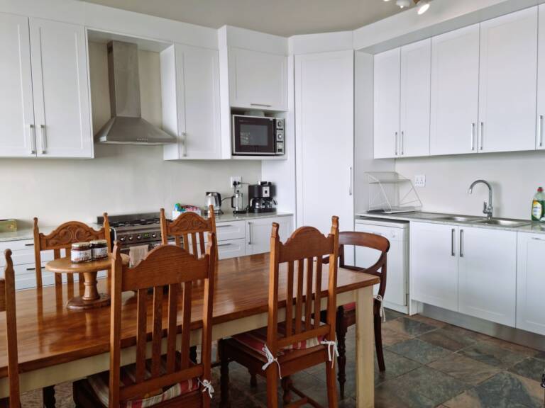 bikini beach holiday home gordons bay 20 kitchen with dining area 768x576