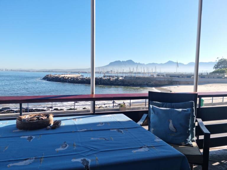 bikini beach holiday home gordons bay 28 balcony dining with ocean view 768x576