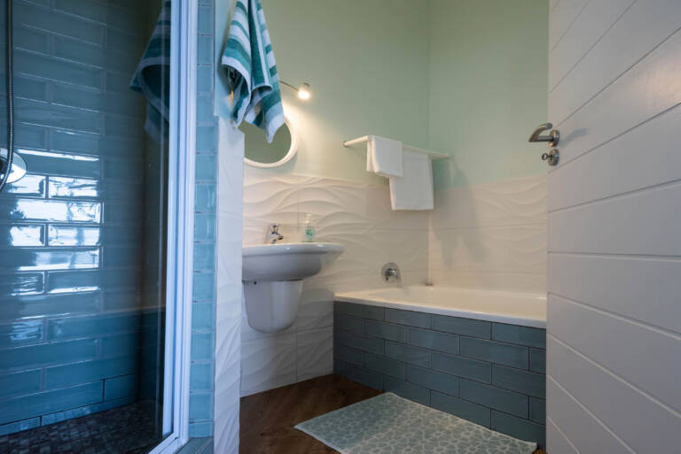 bikini views gordons bay 13 bathroom with bath and shower 768x513