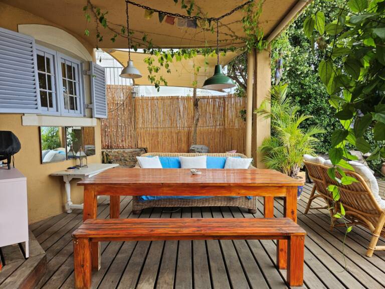 cardamom cottage gordons bay 04 veranda with dining and sea view 768x576