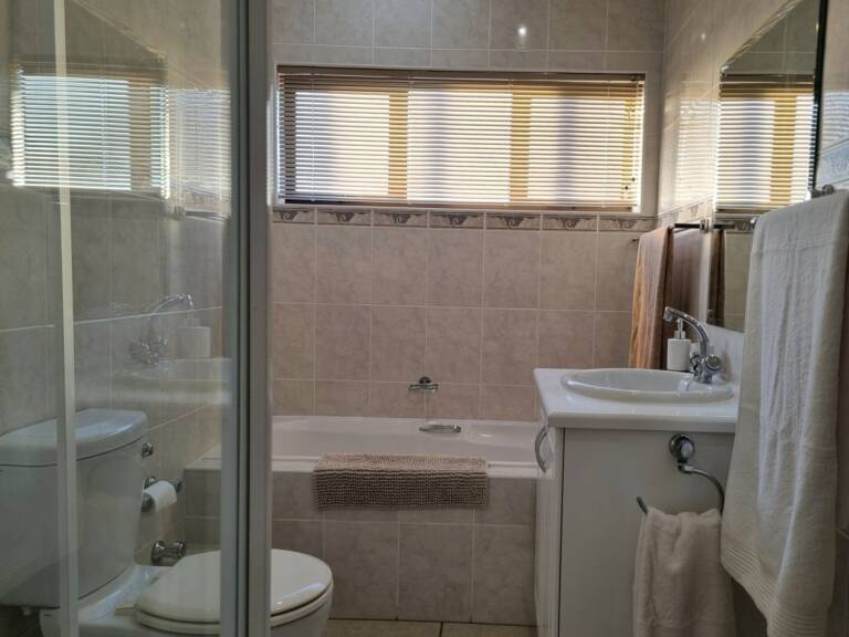 flat9 summer place gordons bay 20 bathroom with bath and shower 768x576