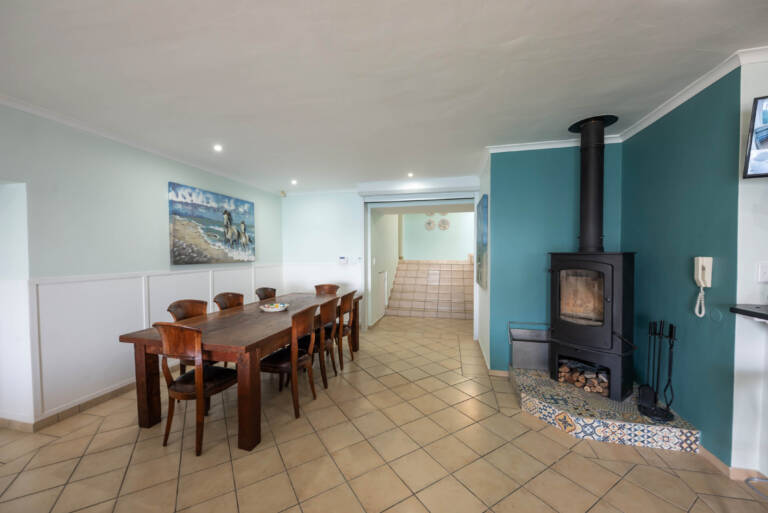 ocean views gordons bay 07 dining room with fire place 768x513