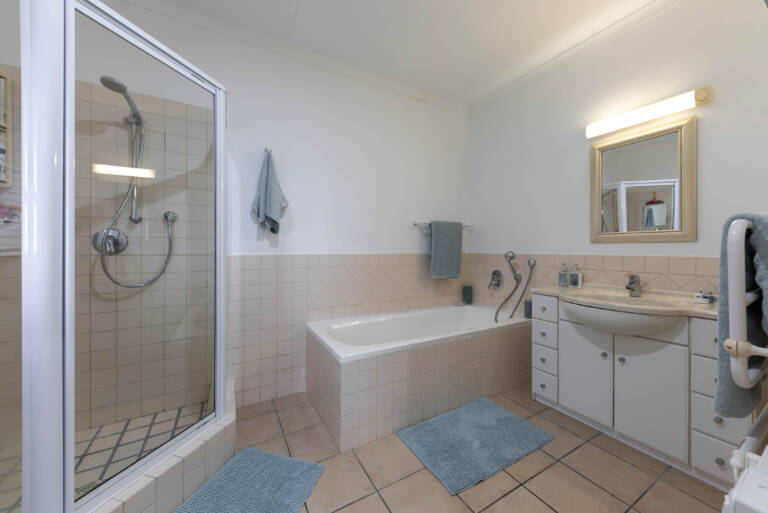 ocean views gordons bay 17 bathroom with bath and shower 768x513