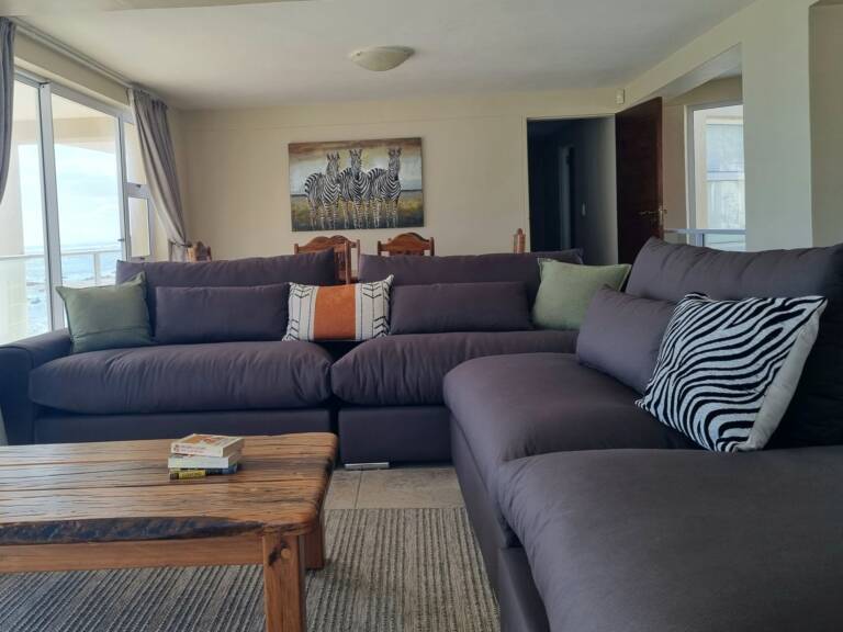 paradise tide gordons bay 44 living room with sea view dining 768x576