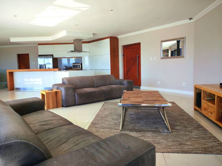 sugar beach penthouse gordons bay 11 lounge with modern furnishings 1 768x576