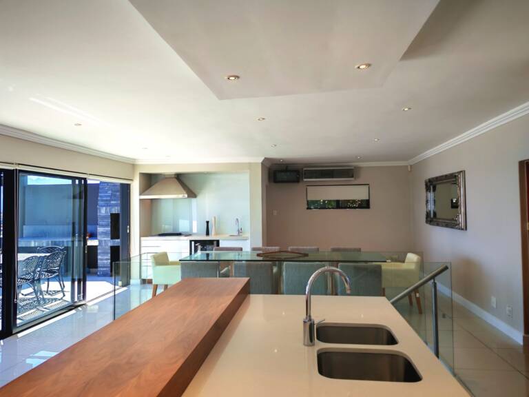 sugar beach penthouse gordons bay 18 open plan living with modern kitchen 1 768x576