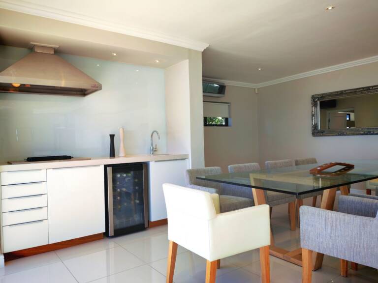 sugar beach penthouse gordons bay 25 indoor braai with dining table 1 768x576