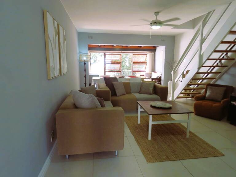 terrace on sea gordons bay 05 living room with dining table 768x576