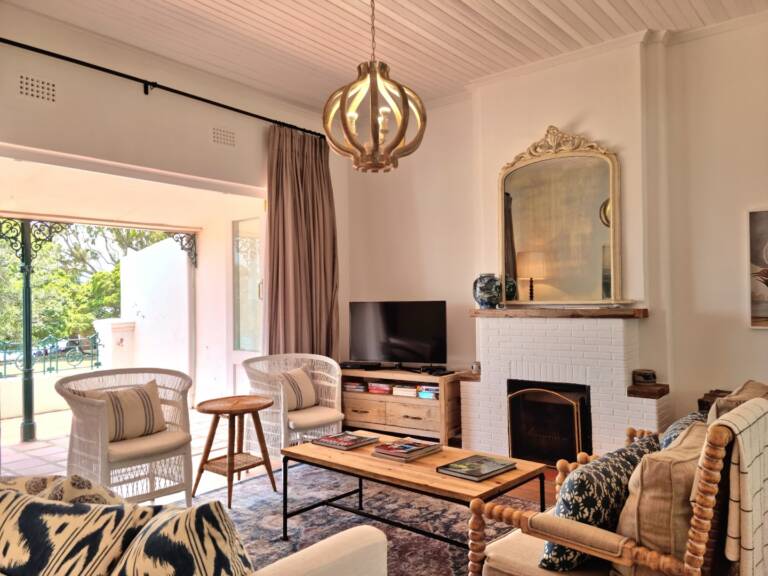 the milkwood cottage gordons bay 05 living room with fire place and tv 768x576