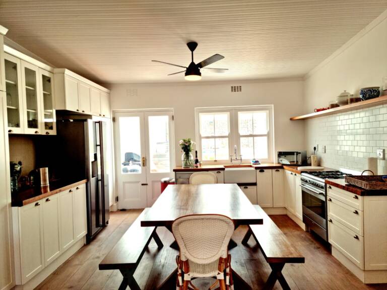 the milkwood cottage gordons bay 15 open plan kitchen with dining table 768x576
