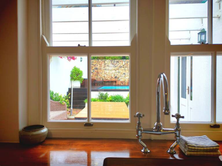 the milkwood cottage gordons bay 17 kitchen with pool view 768x576
