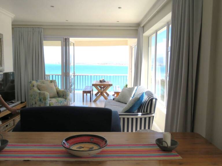 the penthouse gordons bay 06 open plan living with undercover veranda 768x576