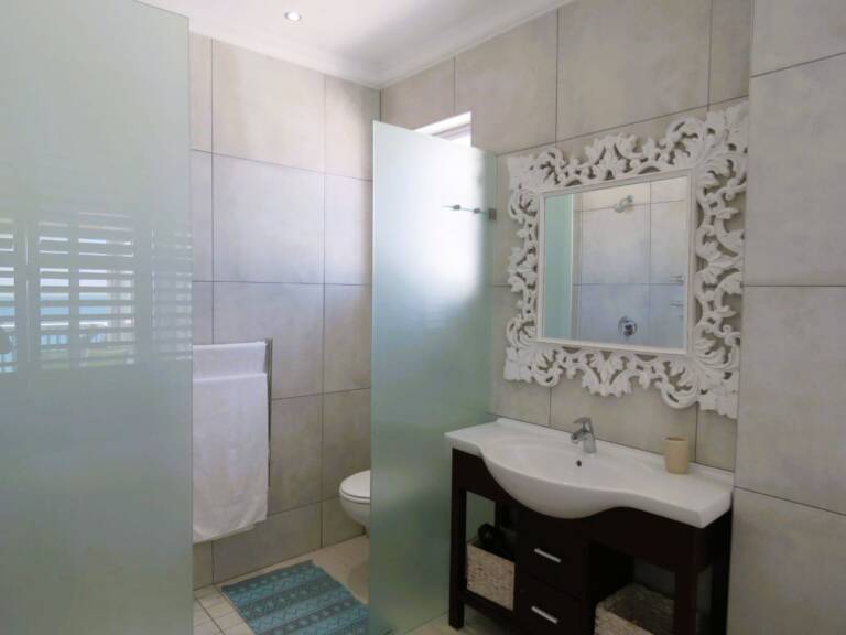the penthouse gordons bay 13 bathroom with bath and shower 768x576