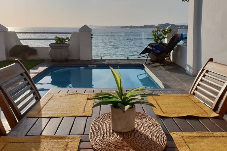 westbank private beach villa gordons bay 03 outdoor dining with pool and sea views 768x512