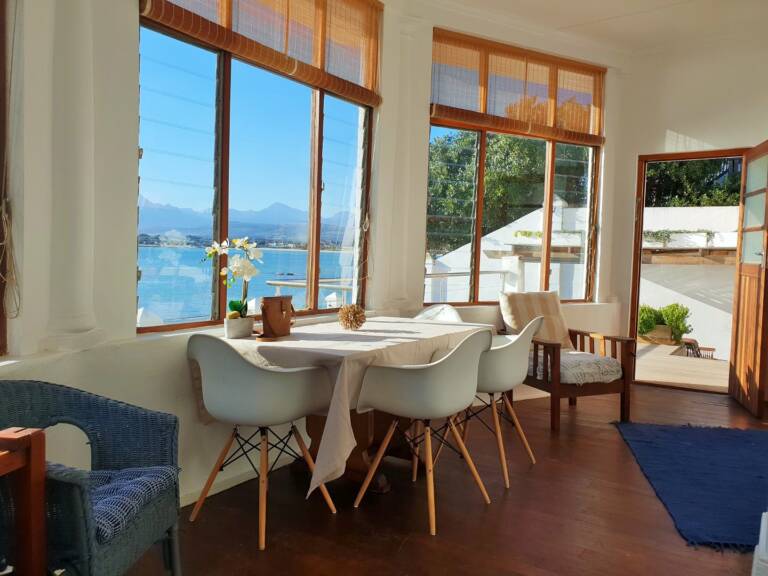 westbank private beach villa gordons bay 07 dining table with garden and pool view 768x576